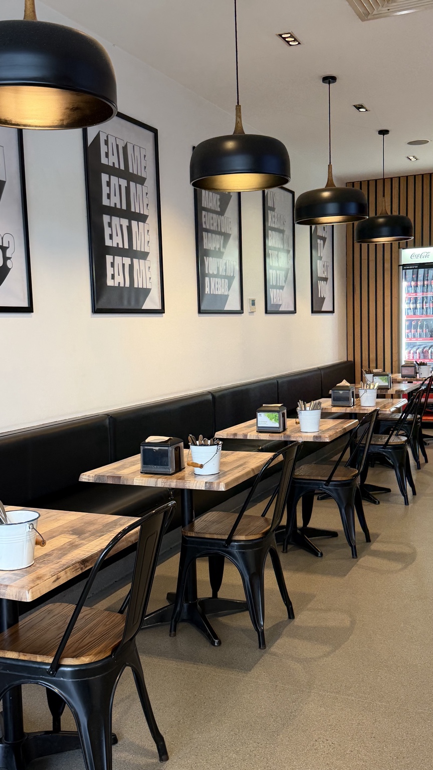 The clean black and white dining room at Anatolian Grill in Coburg North